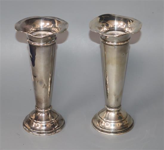 A pair of George V silver vases by William Hutton & Sons, Birmingham, 1913, weighted.